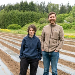 Photo of Matthew and Laura standing at the UBC Farm