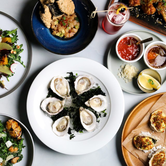 A variety of dishes served at Wildlight, including oysters