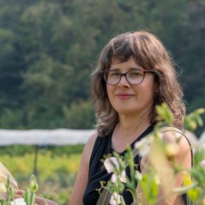 Headshot of Risa Sargent in the fields of UBC Farm